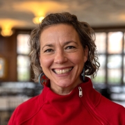 Emily Larson Headshot - wearing red shirt